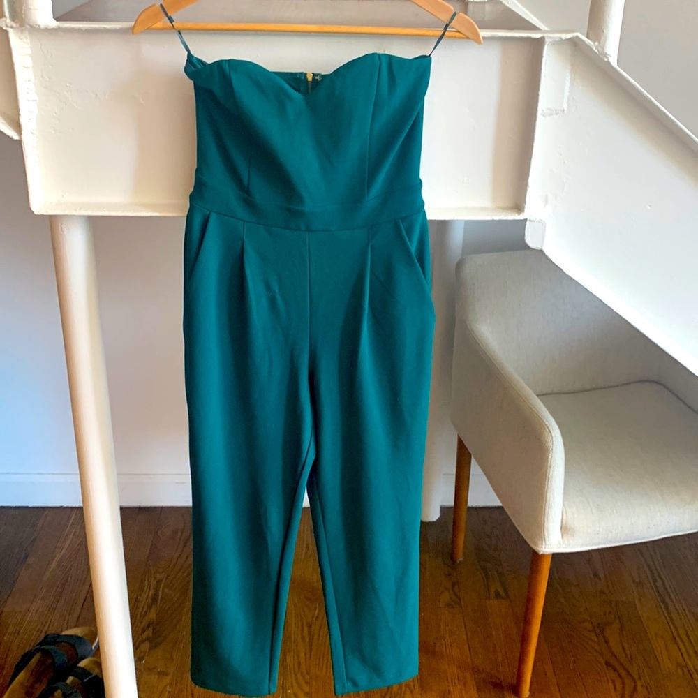 Green jumpsuit from express. Size 2 but fits like a 4. Super flattering on.